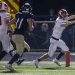Stanwoods Canyon Bumgarner reaches the ball in to the end zone during the Stilly Cup against Arlington on Sept. 30, 2022, in Arlington. (Olivia Vanni / The Herald)