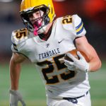 Ferndales Conner Walcker turns the corner and heads for the sideline against Stanwood on Oct. 21, 2022, at Stanwood. (Ryan Berry / The Herald)