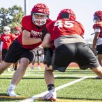 Stanwoods offensive line runs through hitting drills at practice on Aug. 18, 2023, in Stanwood. (Olivia Vanni / The Herald)