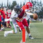 Marysville Pilchuck’s Kenai Sinaphet reaches out to try and cross into the end zone for a touchdown during the game against Maryville Getchell on Friday, Sept. 16, 2022 in Marysville, Washington. (Olivia Vanni / The Herald)