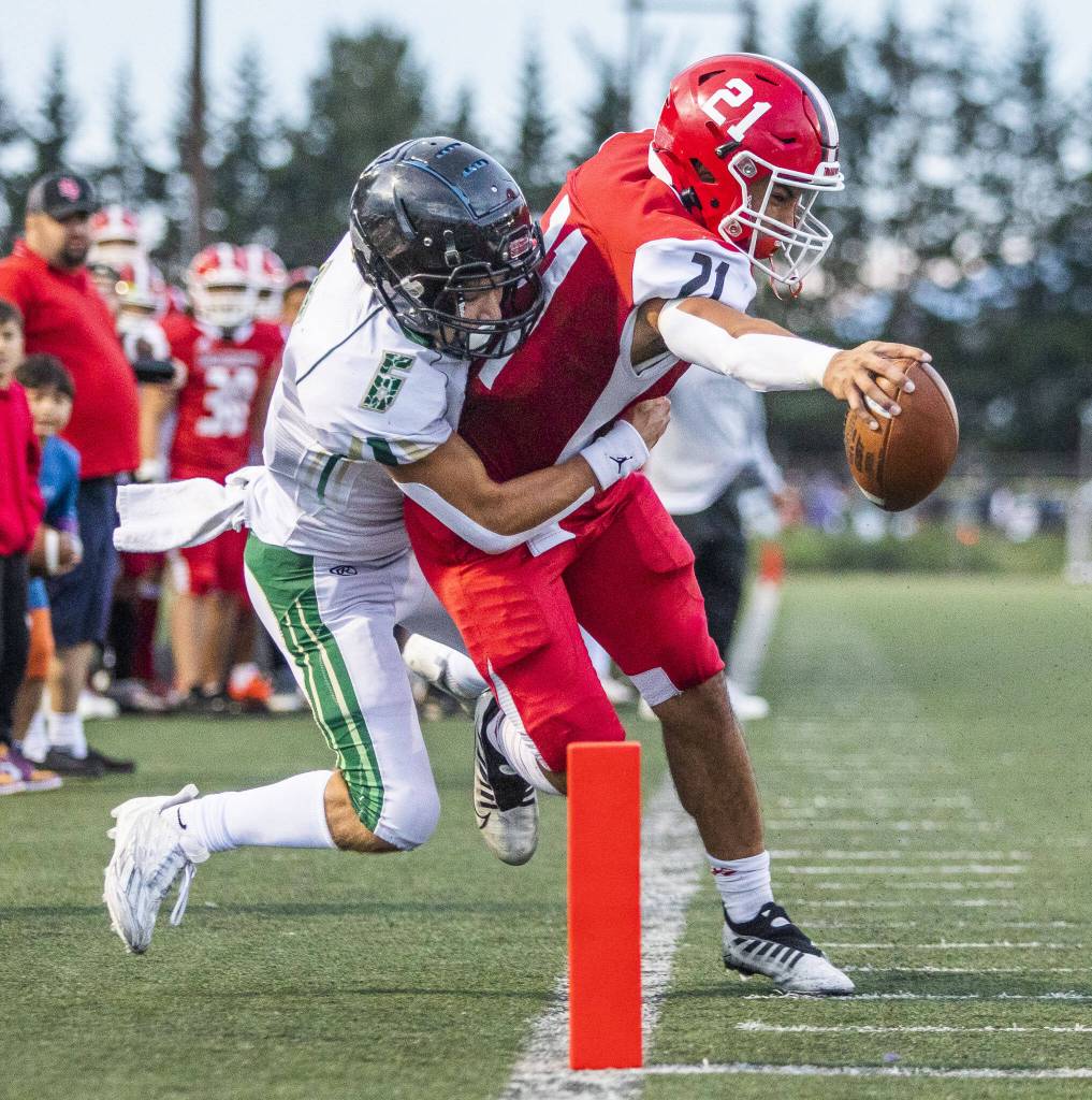 Marysville Pilchuck’s Kenai Sinaphet reaches out to try and cross into the end zone for a touchdown during the game against Maryville Getchell on Friday, Sept. 16, 2022 in Marysville, Washington. (Olivia Vanni / The Herald)
