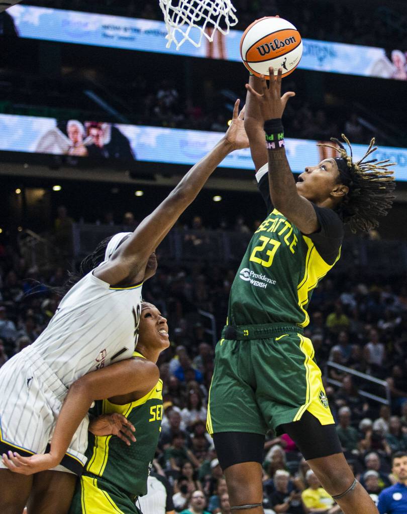 Seattle Storms Mercedes Russell holds back Chicago Skys Elizabeth Williams while Seattle Storms Jordan Horston jumps up to make a rebound during the game at Climate Pledge Arena on Sunday, Aug. 27, 2023 in Seattle, Washington. (Olivia Vanni / The Herald)