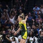 The crowd cheers and Seattle Storms Sami Whitcomb points to Seattle Storms Jewell Loyd after she makes a three-point shot during the game against the Chicago Sky at Climate Pledge Arena on Sunday, Aug. 27, 2023 in Seattle, Washington. (Olivia Vanni / The Herald)