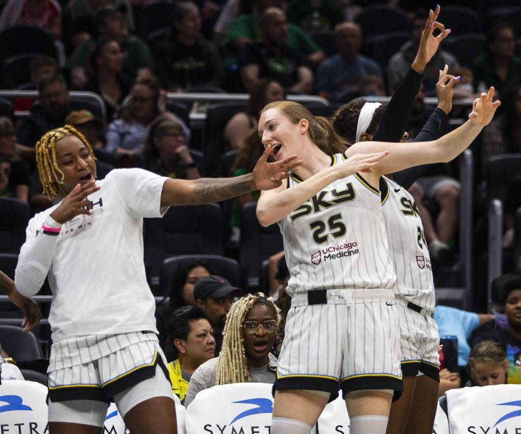 The Chicago Sky bench reacts to a teammates three-point shot during the game against the Seattle Storm at Climate Pledge Arena on Sunday, Aug. 27, 2023 in Seattle, Washington. (Olivia Vanni / The Herald)