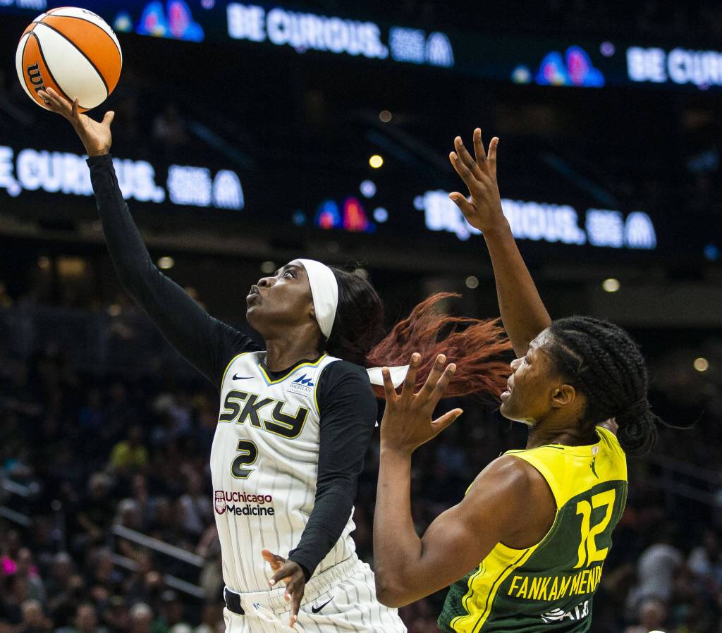 Chicago Skys Kahleah Copper manners around Seattle Storms Dulcy Fankam Mendjiadeu to make a layup during the game at Climate Pledge Arena on Sunday, Aug. 27, 2023 in Seattle, Washington. (Olivia Vanni / The Herald)