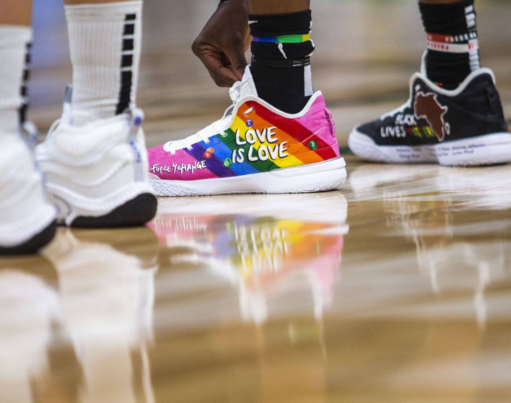 Seattle Storms Jordan Horston adjust their laces during the game against the Chicago Sky at Climate Pledge Arena on Sunday, Aug. 27, 2023 in Seattle, Washington. (Olivia Vanni / The Herald)