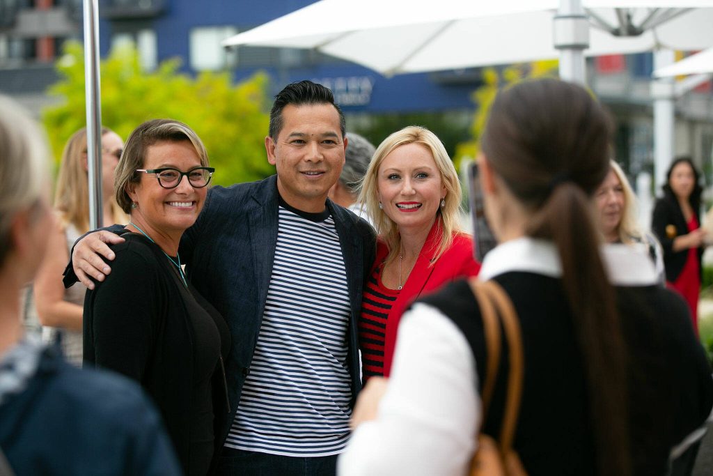 Fisherman Jacks owner Jack Ng takes a photo with Everett Mayor Cassie Franklin, left, and Port of Everett CEO Lisa Lefeber, right, during the restaurants opening on Wednesday, August 30, 2023, in Everett, Washington. (Ryan Berry / The Herald)