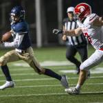 Arlingtons Leyton Martin runs the ball during the Stilly Cup rivalry game against Stanwood Sept. 30, 2022, in Arlington. (Olivia Vanni / The Herald)