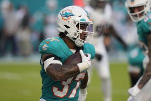 Miami Dolphins running back Myles Gaskin (37) runs the ball during the first half of an NFL preseason football game against the Atlanta Falcons, Friday, Aug. 11, 2023, in Miami Gardens, Fla. (AP Photo/Marta Lavandier)