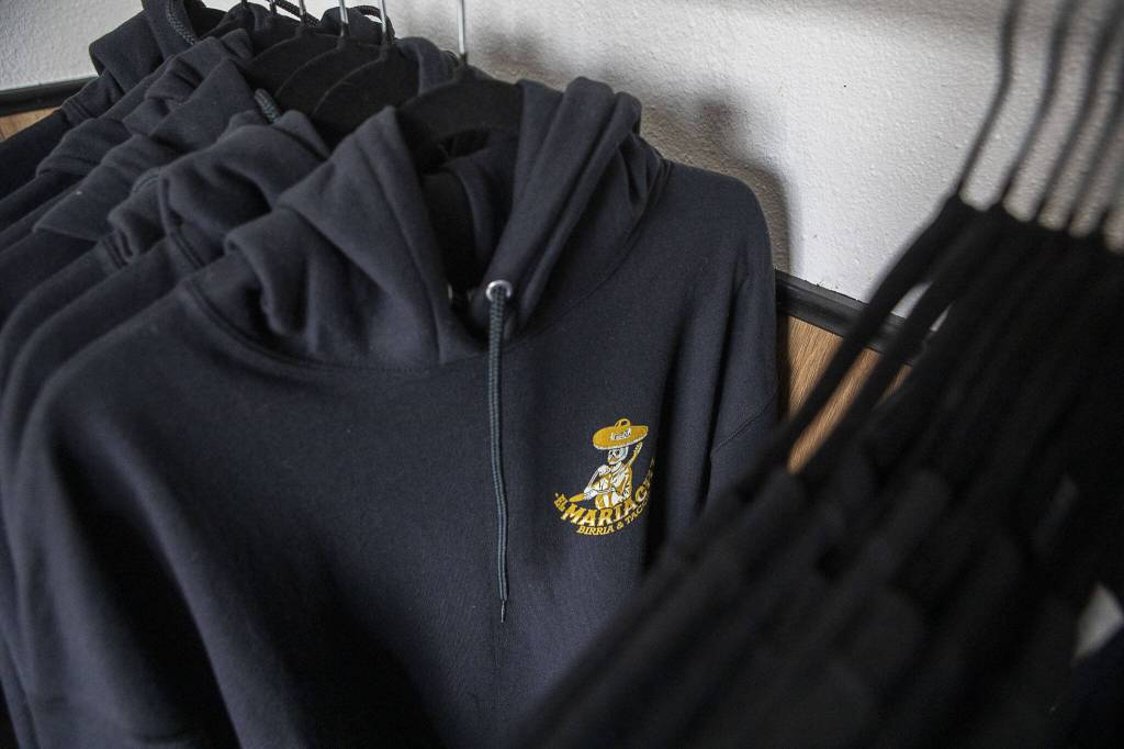 Hoodies for sale at El Mariachi in Everett, Washington on Wednesday, July 5, 2023. (Annie Barker / The Herald)