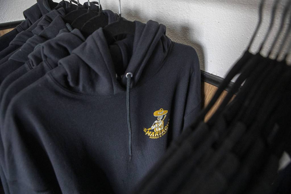 Hoodies for sale at El Mariachi in Everett, Washington on Wednesday, July 5, 2023. (Annie Barker / The Herald)