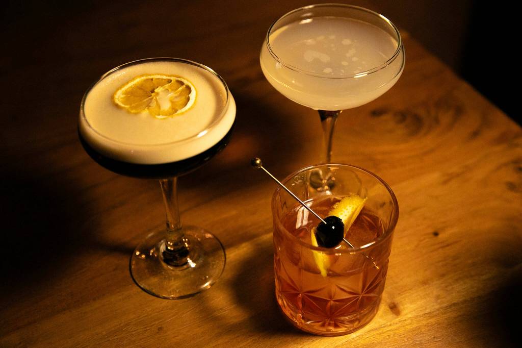 Unique takes on the espresso martini, left, gin corpse reviver, top right and old fashioned are served at 16Eleven on Wednesday, August 23, 2023, in downtown Everett, Washington. (Ryan Berry / The Herald)