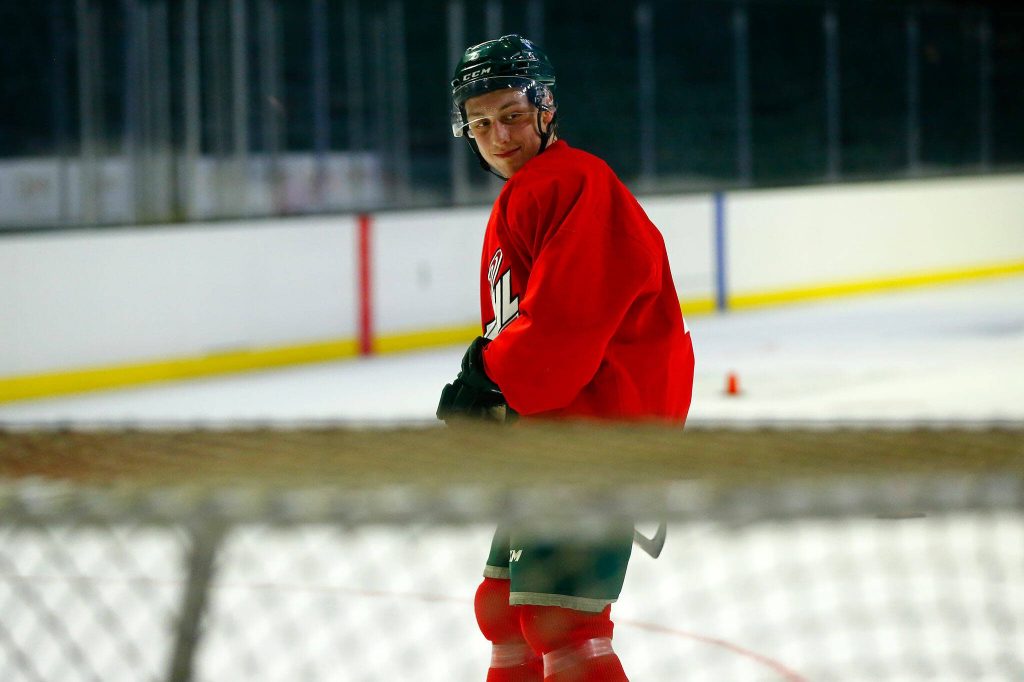Ty Gibson smiles after taking a shot during the first day of Silvertips training camp on Thursday, August 31, 2023, at Angel of the Winds Arena in Everett, Washington. (Ryan Berry / The Herald)