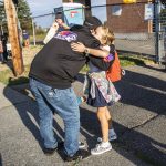 Ray Stonehocker hugs his daughter Kinley before she leaves to start her first day for fourth grade at Whittier Elementary on Wednesday, Sept. 6, 2023 in Everett, Washington. (Olivia Vanni / The Herald)