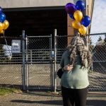 A child hugs their parent before leaving to start their first day of school at Whittier Elementary on Wednesday, Sept. 6, 2023 in Everett, Washington. (Olivia Vanni / The Herald)