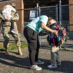 A parent says goodbye to their child before the start of school at Whittier Elementary on Wednesday, Sept. 6, 2023 in Everett, Washington. (Olivia Vanni / The Herald)