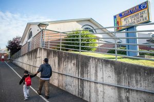 A parent walks their children to class at Whittier Elementary on Wednesday, Sept. 6, 2023 in Everett, Washington. (Olivia Vanni / The Herald)