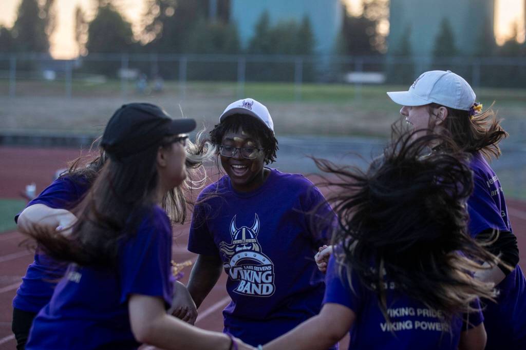 Members of the Lake Stevens marching band dance during a football game between Lake Stevens and Garfield at Lake Stevens High School in Lake Stevens, Washington on Friday, Sept. 1, 2023. The Vikings won 48-21. (Annie Barker / The Herald)