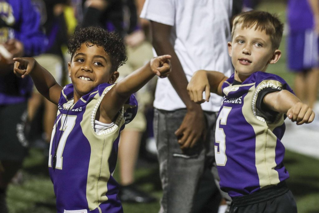 Kids dance after a touchdown during a football game between Lake Stevens and Garfield at Lake Stevens High School in Lake Stevens, Washington on Friday, Sept. 1, 2023. The Vikings won 48-21. (Annie Barker / The Herald)