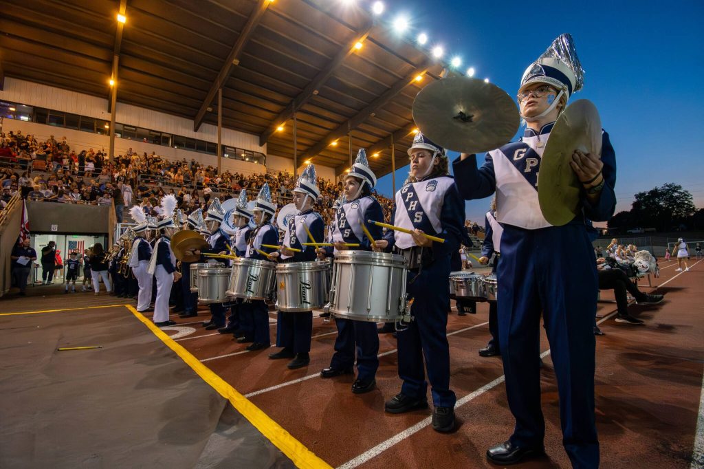The Glacier Peak marching band percussion section performs at halftime while waiting for their football team to emerge from the locker room during a game against Snohomish on Sept. 1, 2023, at Snohomish High School. (John Gardner / Pro Action Image)