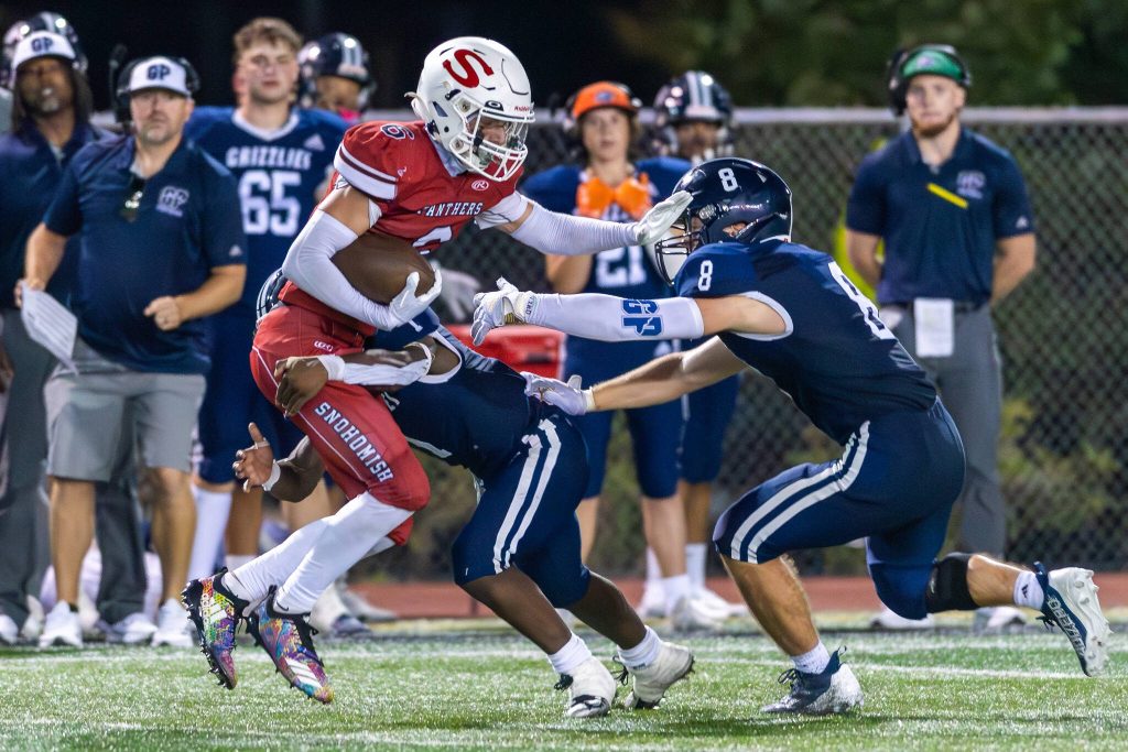 Glacier Peak players Chrisvin Bonshe (1) and Bradley Perman (8) close in on Snohomishs Parker Jackson (6) during a game on Sept. 1, 2023, at Snohomish High School. (John Gardner / Pro Action Image)