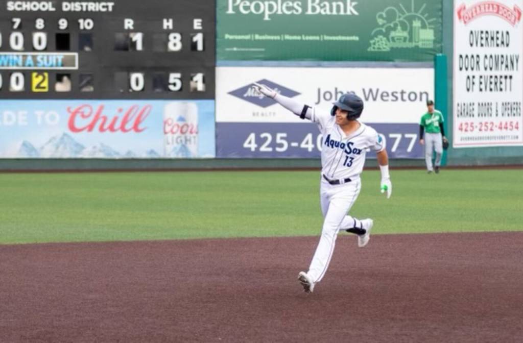 The AquaSoxs Ben Ramirez points to teammates as he rounds the bases after hitting a home run in the bottom of the eighth inning of a game against the Emeralds on Monday, Sept. 4, 2023, in Everett. (Photo provided by AquaSox)