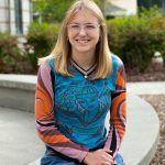 United Student Leaders co-leader Audrey Gmerek, a senior, sits outside South Whidbey High School on Thursday, Sep. 7, 2023, in Langley, Washington. (Ryan Berry / The Herald)