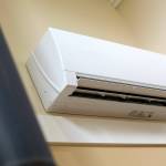 A Mitsubishi Electric heat pump is installed on the wall of Jim and Chris Hall home on Thursday, Sep. 7, 2023, near Langley, Washington. (Ryan Berry / The Herald)