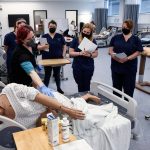 Catherine Robinweiler leads the class during a lab session at Edmonds College on April 29, 2021. (Kevin Clark / The Herald)