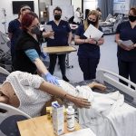 Catherine Robinweiler leads the class during a lab session at Edmonds College on April 29, 2021. (Kevin Clark / The Herald)