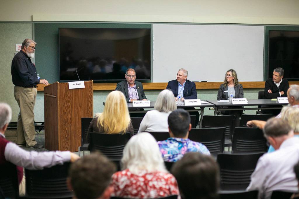 Everett Herald Opinion Editor Jon Bauer, left, moderates the discussion during the Heralds public forum on affordable housing at the Lynnwood Library on Thursday, Sept. 14, 2023, in Lynnwood, Washington. (Ryan Berry / The Herald)