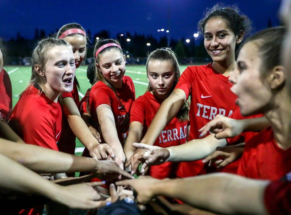 The Mountlake Terrace Hawks rally before a match against Archbishop Murphy on Sept. 22, 2022, at Lynnwood High School in Bothell. (Kevin Clark / The Herald)
