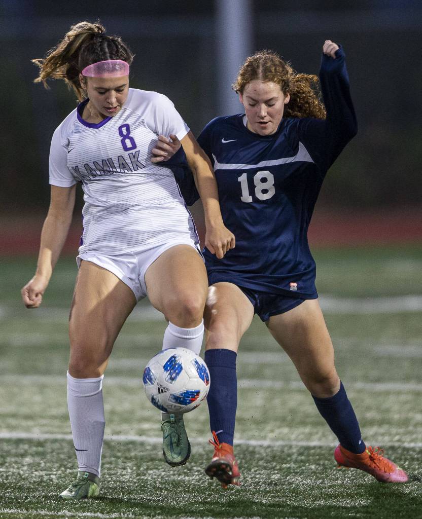Glacier Peaks Brynna Pukis (right) fights for the ball during the game against Kamiak on Sept. 29, 2022, in Snohomish. (Olivia Vanni / The Herald)