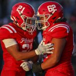 Marysville Pilchuck’s Kenai Sinaphet (21) and Braxton Leiu-Sopi (62) celebrate during a football game between Marysville Pilchuck and Stanwood at Marysville Pilchuck High School in Marysville, Washington on Friday, Sept. 8, 2023. Marysville Pilchuck takes the win, 36-7. (Annie Barker / The Herald)