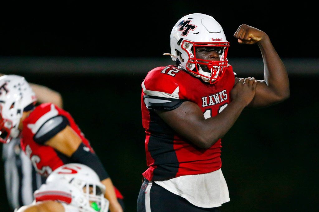 Mountlake Terrace senior Zaveon Jones flexes after a big defensive stop against Snohomish on Friday, Sept. 8, 2023, at Edmonds Stadium in Edmonds, Washington. (Ryan Berry / The Herald)