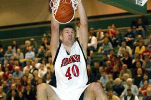 Herald Photo by Dan Bates
Jon Brockman slams the ball through with both hands during 2nd half action Tuesday night as Snohomish squeaked past Mariner to advance in the 4A playoff picture.
