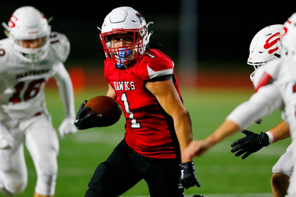 Mountlake Terraces Logan Tews turns a reception up the field against Snohomish on Sept. 8 at Edmonds Stadium in Edmonds. (Ryan Berry / The Herald)