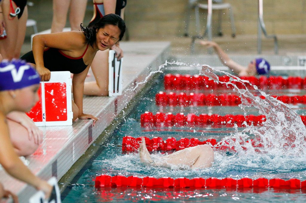 A swimmer gets splashed as Lake Stevens’ Addison Bowen makes a turn in the 500 yard freestyle during an early season meet between Snohomish and Lake Stevens on Tuesday, Sept. 12, 2023, at the Snohomish Aquatic Center in Snohomish, Washington. (Ryan Berry / The Herald)
