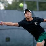 Jacksons Ben Lee lunges to get to the ball during a match against Kamiak on Sept. 22, 2022, at the Kamiak Tennis Courts in Mukilteo. (Ryan Berry / The Herald)