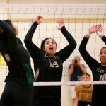 Lynnwood blockers Makena Kaleo (29) and Harmony Johnson (10) prepare for a spike from Jacksons Sakura Yokoo during a volleyball match Thursday, Sept. 14, 2023, at Lynnwood High School in Bothell, Washington. (Ryan Berry / The Herald)