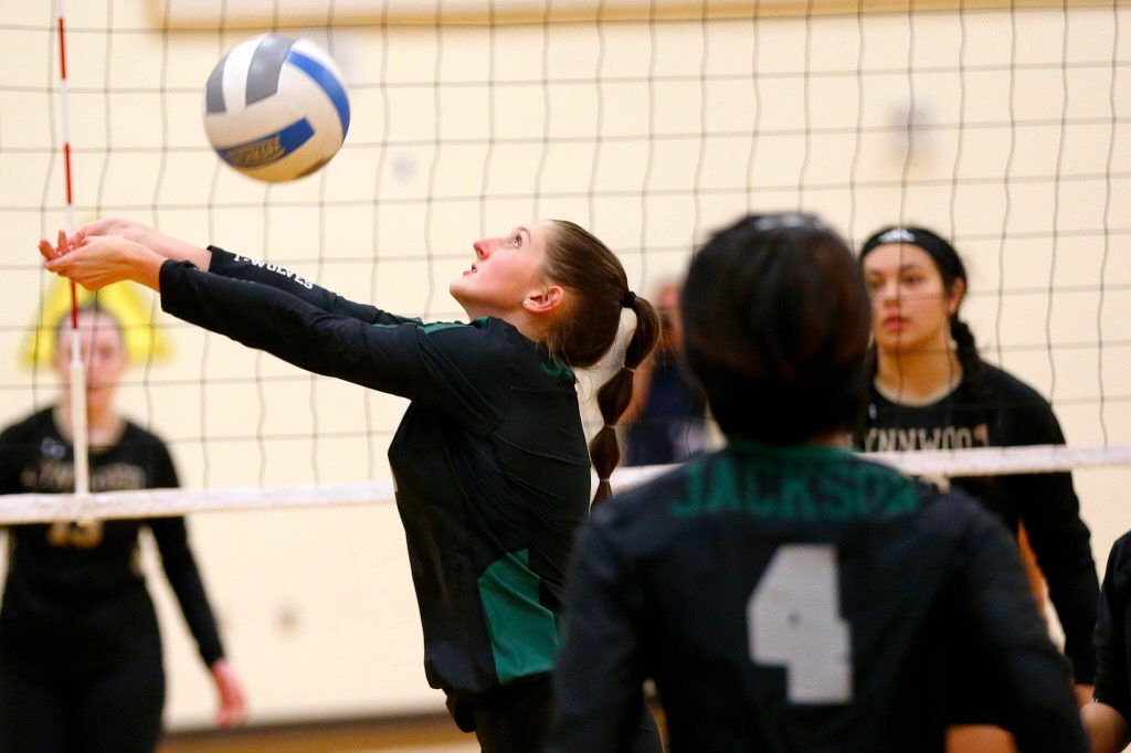 Jacksons London Redd bumps the ball back over her head and towards the net against Lynnwood during a volleyball match Thursday, Sept. 14, 2023, at Lynnwood High School in Bothell, Washington. (Ryan Berry / The Herald)