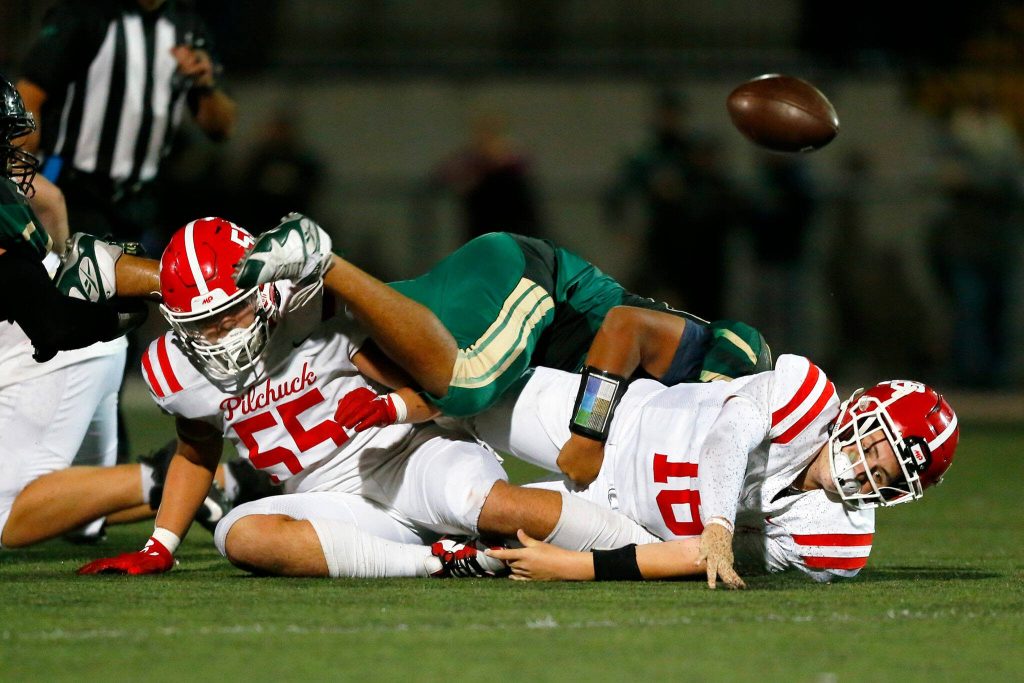 Marysville Getchell lineman Andres Arostegui takes down Pilchuck quarterback Luke Shoemaker for a sack during the Berry Bowl on Friday, Sept. 15, 2023, at Quil Ceda Stadium in Marysville, Washington. (Ryan Berry / The Herald)