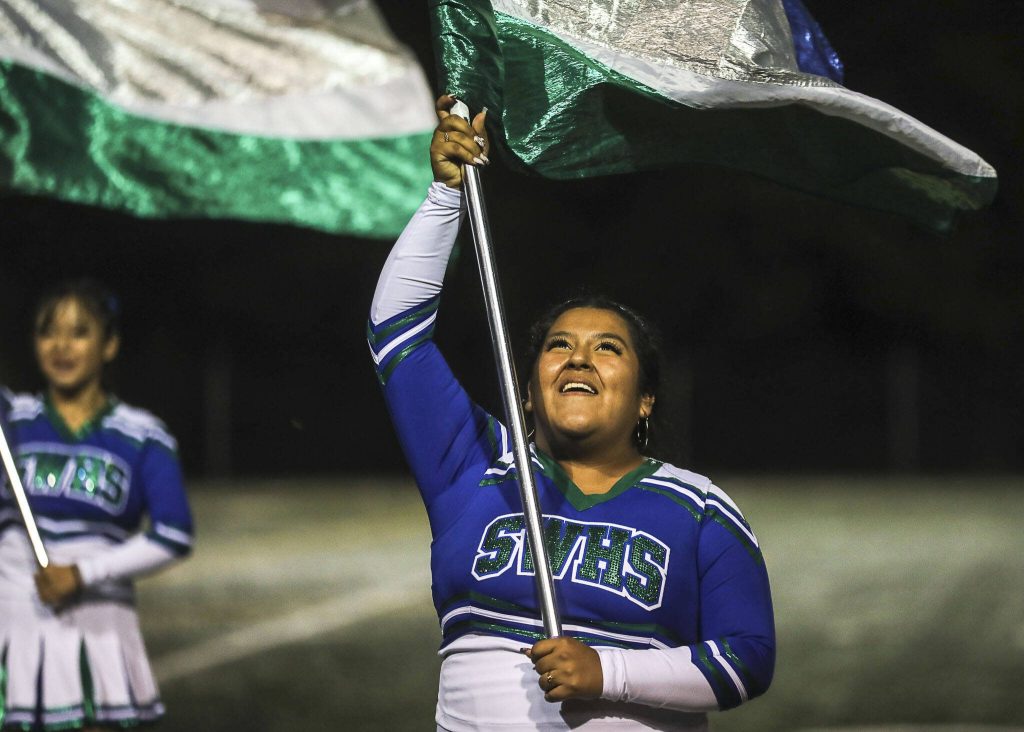 A Shorewood color guard performer smiles during a football game between Mountlake Terrace and Shorewood at Shoreline Stadium in Shoreline, Washington on Friday, Sept. 15, 2023. Mountlake Terrace won, 35-0. (Annie Barker / The Herald)