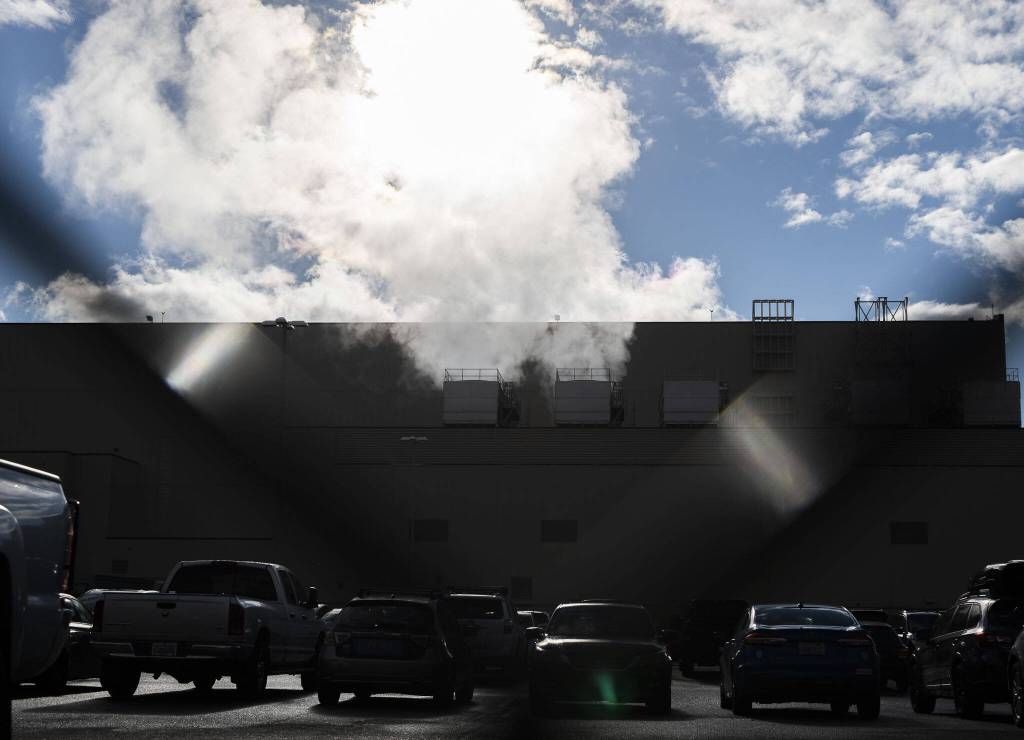 Steam rises from vents at Boeings 40-58 building on Monday, Nov. 28, 2022 in Everett, Washington. (Olivia Vanni / The Herald)