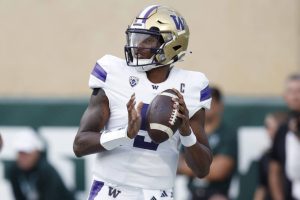 Washington quarterback Michael Penix Jr. looks to throw during the first half of an NCAA college football game against Michigan State, Saturday, Sept. 16, 2023, in East Lansing, Mich. (AP Photo/Al Goldis)