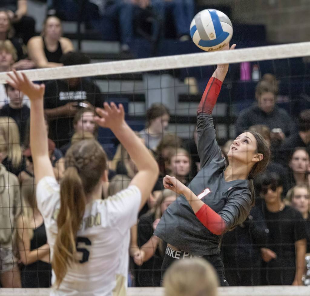 Stanwoods Zoey Halligan spikes the ball during the game against Arlington on Tuesday, Sept. 19, 2023 in Arlington, Washington. (Olivia Vanni / The Herald)