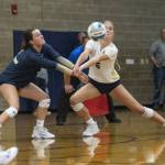 Arlingtons Savannah Roberts, left, and Emme Shaffer, right, collide while both going for a dig during the game against Stanwood on Tuesday, Sept. 19, 2023 in Arlington, Washington. (Olivia Vanni / The Herald)