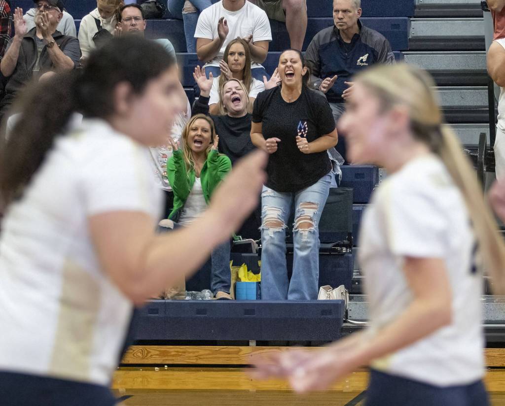 Alrington fans reacts to a point during the game against Stanwood on Tuesday, Sept. 19, 2023 in Arlington, Washington. (Olivia Vanni / The Herald)