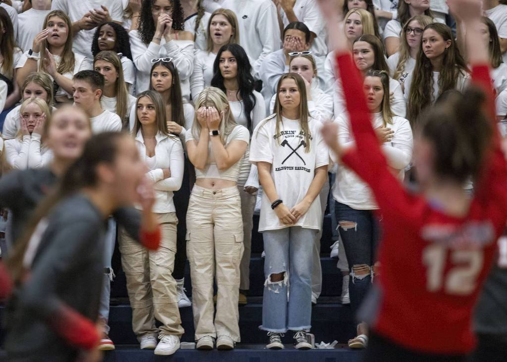 Arlington fans react to Stanwood scoring a point during the game on Tuesday, Sept. 19, 2023 in Arlington, Washington. (Olivia Vanni / The Herald)