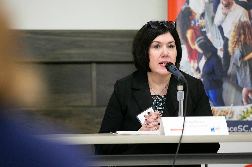 Amy Barto, Healthcare Sector Leader Project Manager at SEIU Healthcare 1199NW, speaks during a Healthcare Summit at Everett Community College on Wednesday, Sept. 27, 2023, in Everett, Washington. (Ryan Berry / The Herald)
